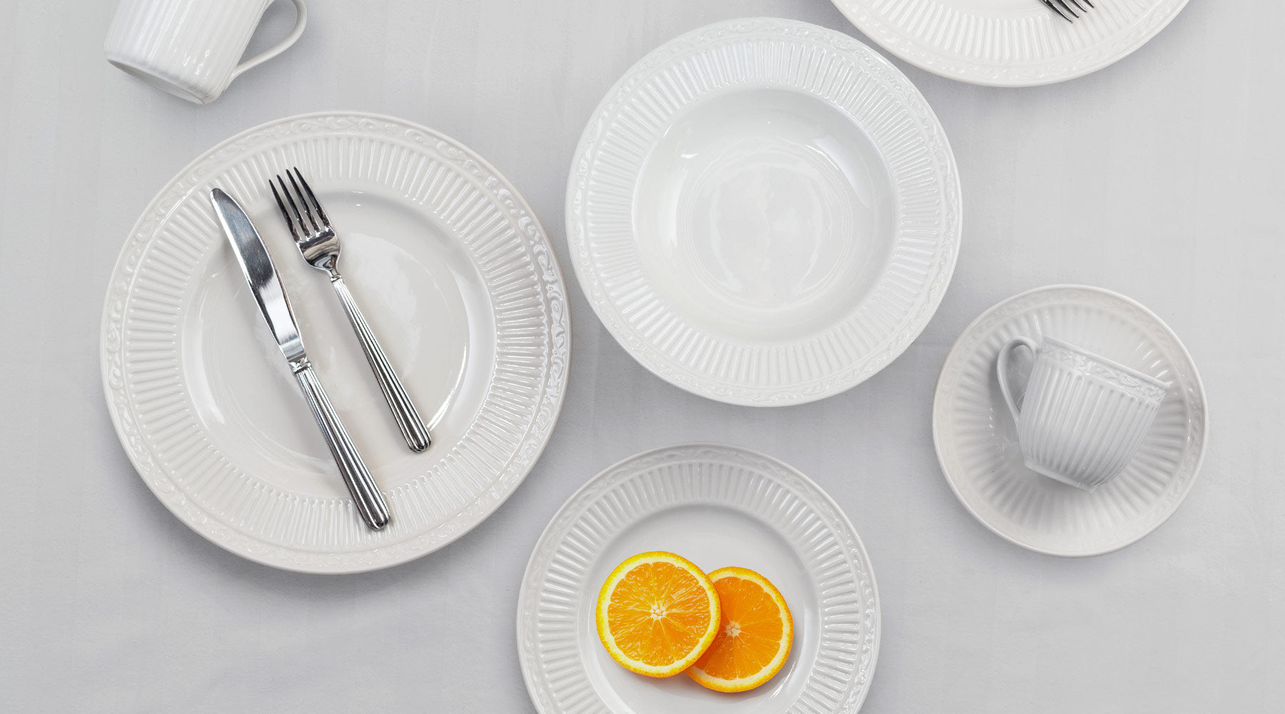The fluted bands and column-like detailing of this dinnerware recall classical Italian architecture. A complete suite of accessories is available to create a classically stylish, casual dining statement.