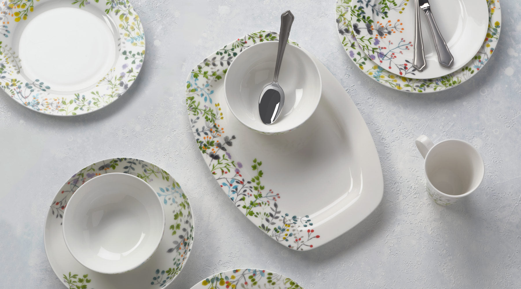 Vivid white is a backdrop for colorful buds and foliage in Mikasa Tivoli Garden.